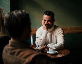 Men sitting at table on first date