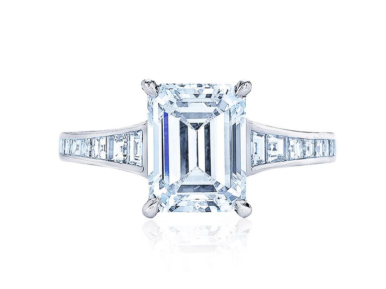 kwiat emerald cut diamond engagement ring with claw prongs and baguette diamond and platinum band