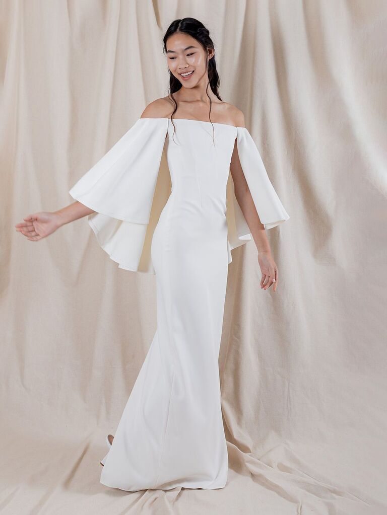 katharine polk plain white off the shoulder wedding dress with mid-length sleeves and form fitting skirt