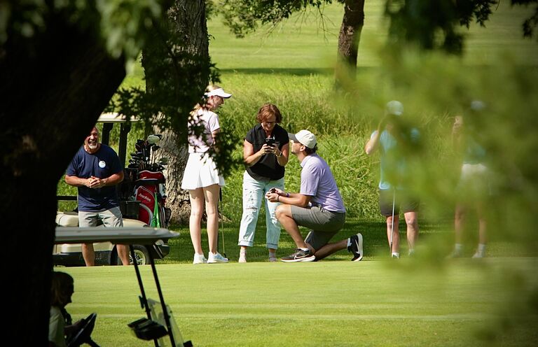 The day Damon proposed! We were in a golf tournament in Kingsley and he surprised me on the last hole of the day. My parents surprised me by driving 3 hours to be there! 
