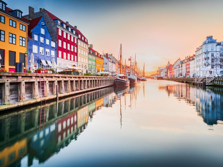 Copenhagen, Denmark. Nyhavn, Kobenhavn's iconic canal, colorful sunrise water reflection