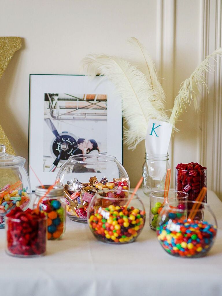 candy bar with small bowls and feathers