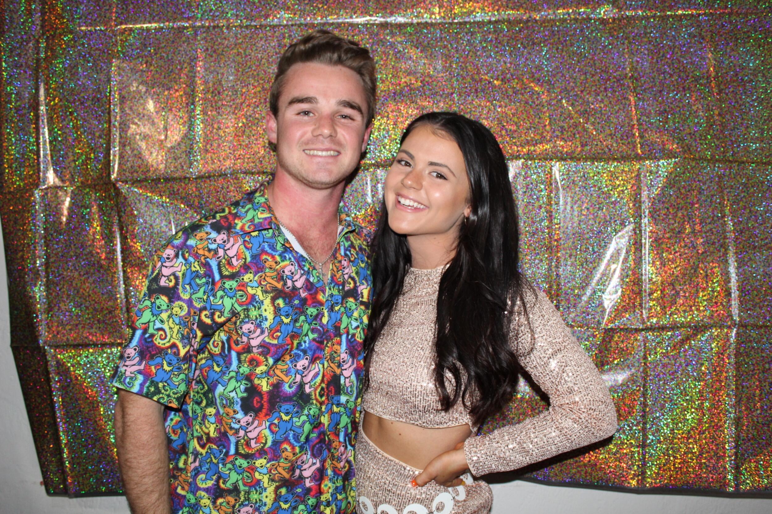 After meeting at the Salty Dog Saloon, Connor and Olivia's very first date was at one of Olivia’s sorority date functions—a decade-themed night full of fun, dancing, and just the beginning of something special.