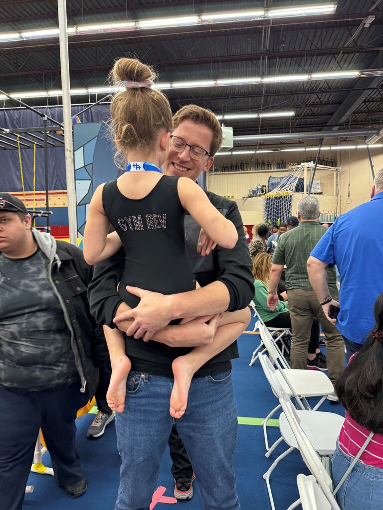 Steve and Sarah get to watch Zoey win her first two Gymnastics medals in a competition. 