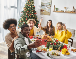 Friends taking selfie at Christmas party