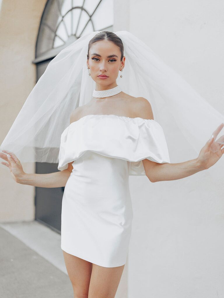 Model wears a beautiful full elbow-length veil. 
