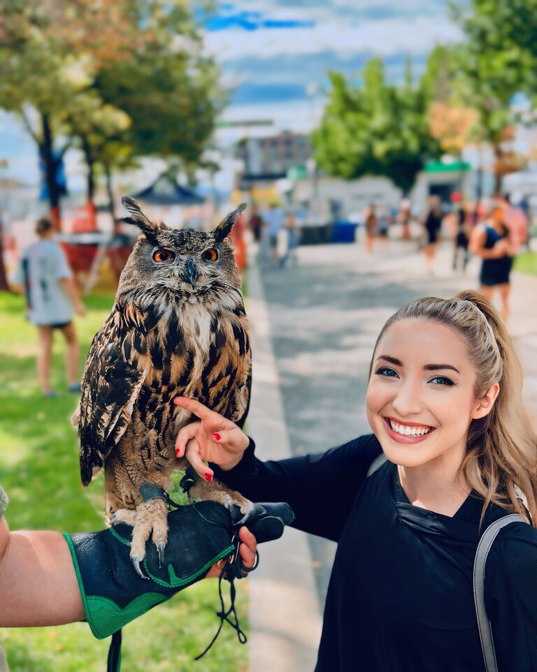 At the farmer's market in downtown Salt Lake, we found a beautiful owl that Brittany got to touch!