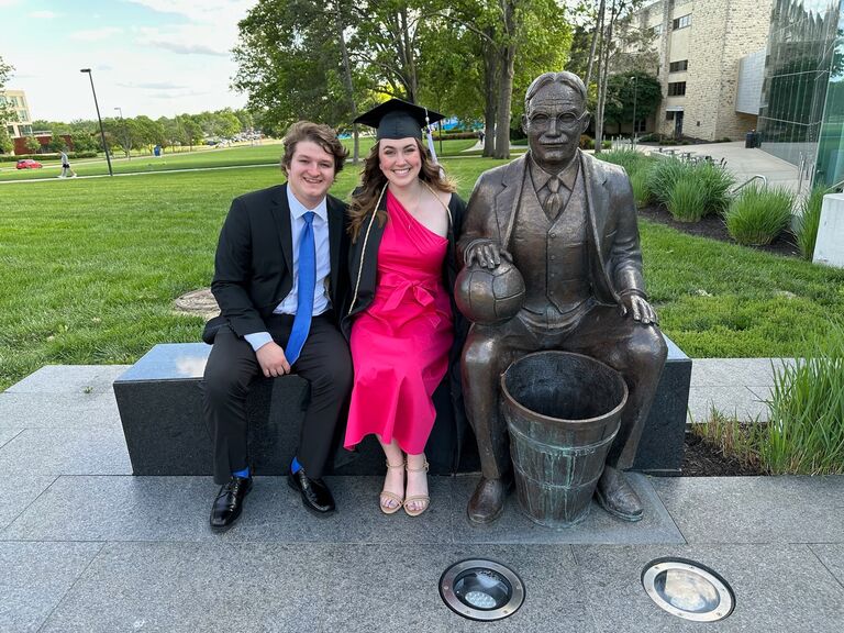 Celebrating Madeline’s graduation from KU! Evan and Madeline sat proudly next to Dr. James Naismith, the inventor of basketball and KU’s first coach, for a photo op. Rock Chalk!