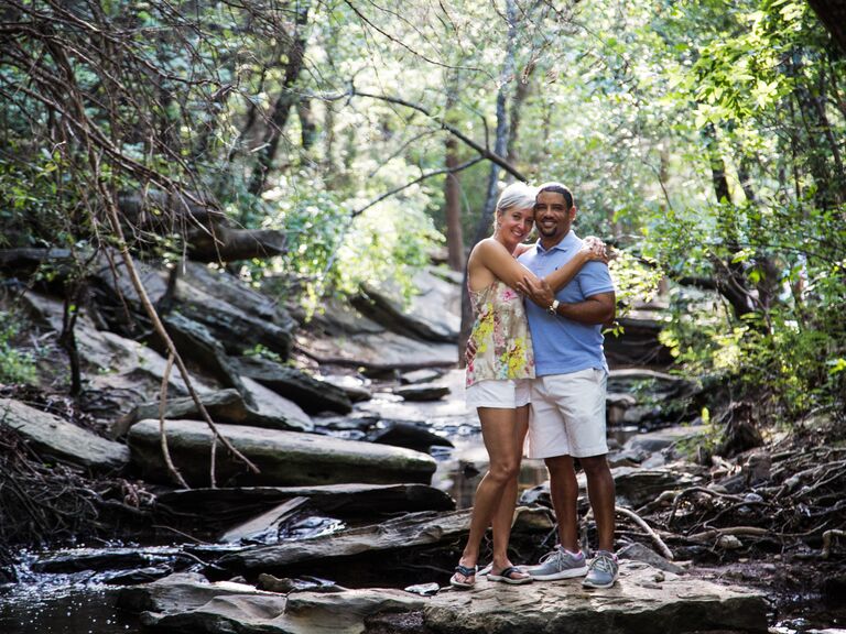 Couple pose in the wilderness. 