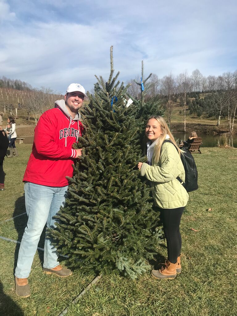 Megan introducing Daniel to her favorite family tradition - Christmas tree picking!