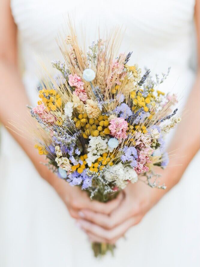 This rustic bouquet, in its pastel shades, showcases dried flowers front and center.