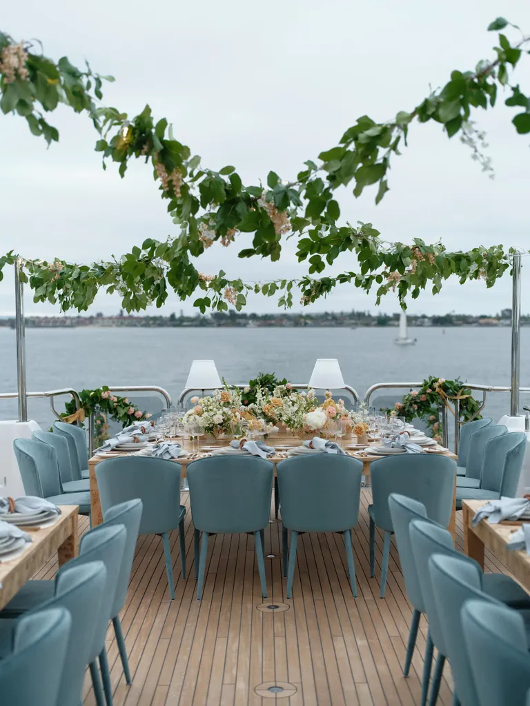 Hanging greenery over blue velvet decor, taylor swift themed wedding 