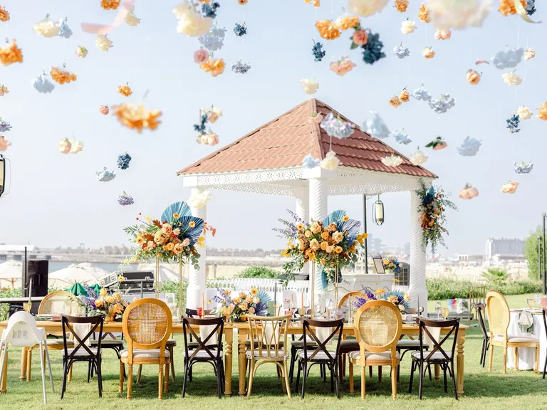 Outdoor fall wedding reception with hanging decor