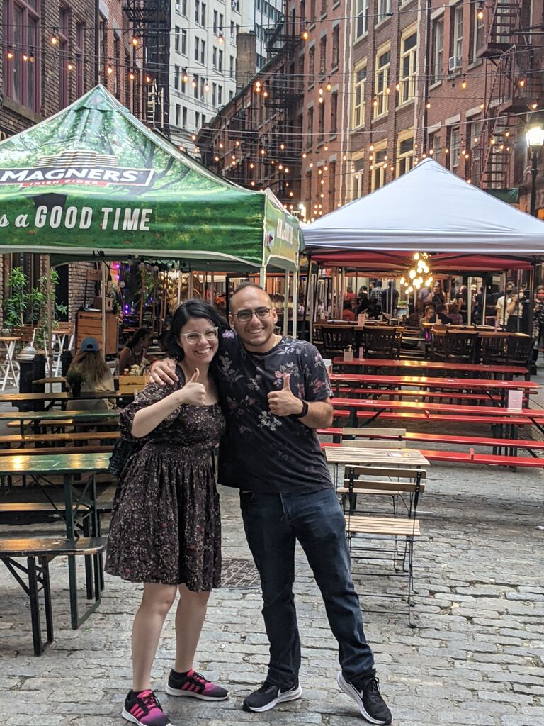 The couple gets their picture taken by Jeny's brother while hanging out in NYC. They are still JUST a couple of good pals