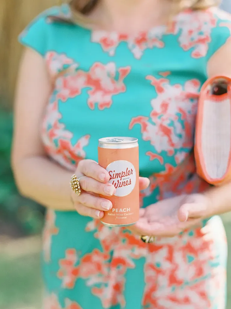 Guest holding a canned cocktail at a wedding