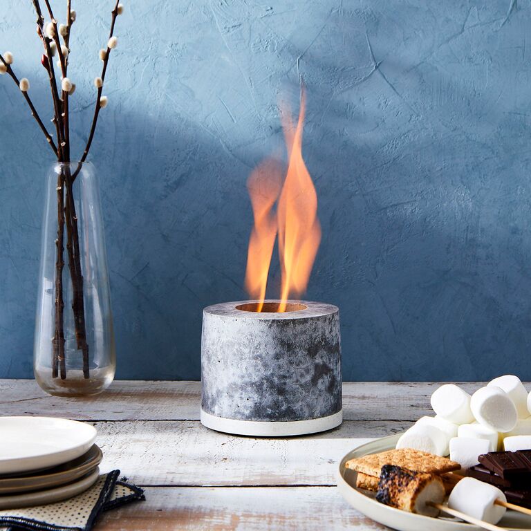 Personal concrete fireplace for outdoor tables