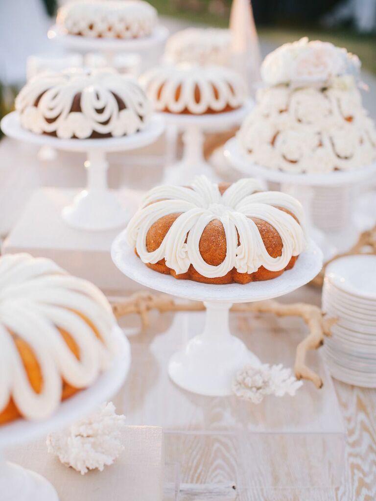 Spread of vintage-inspired bundt wedding cakes with white icing