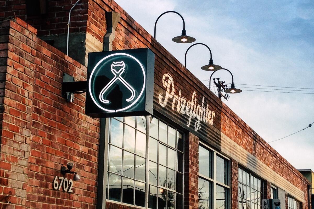 After an awkward asking out process. They decide to go on their first date at Prize Fighter bar in Emeryville.