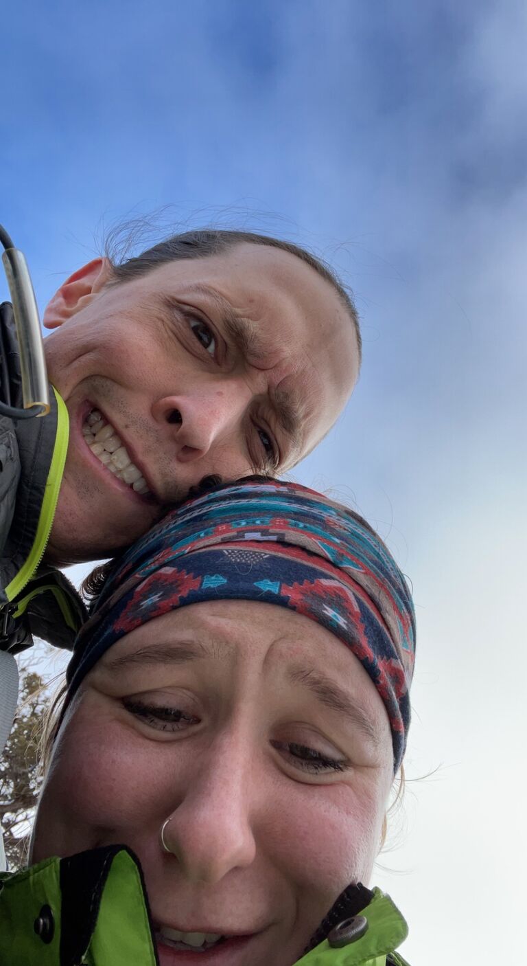 Ivy and Brian struggling to keep from falling during a snowy trip to Arches National Park!