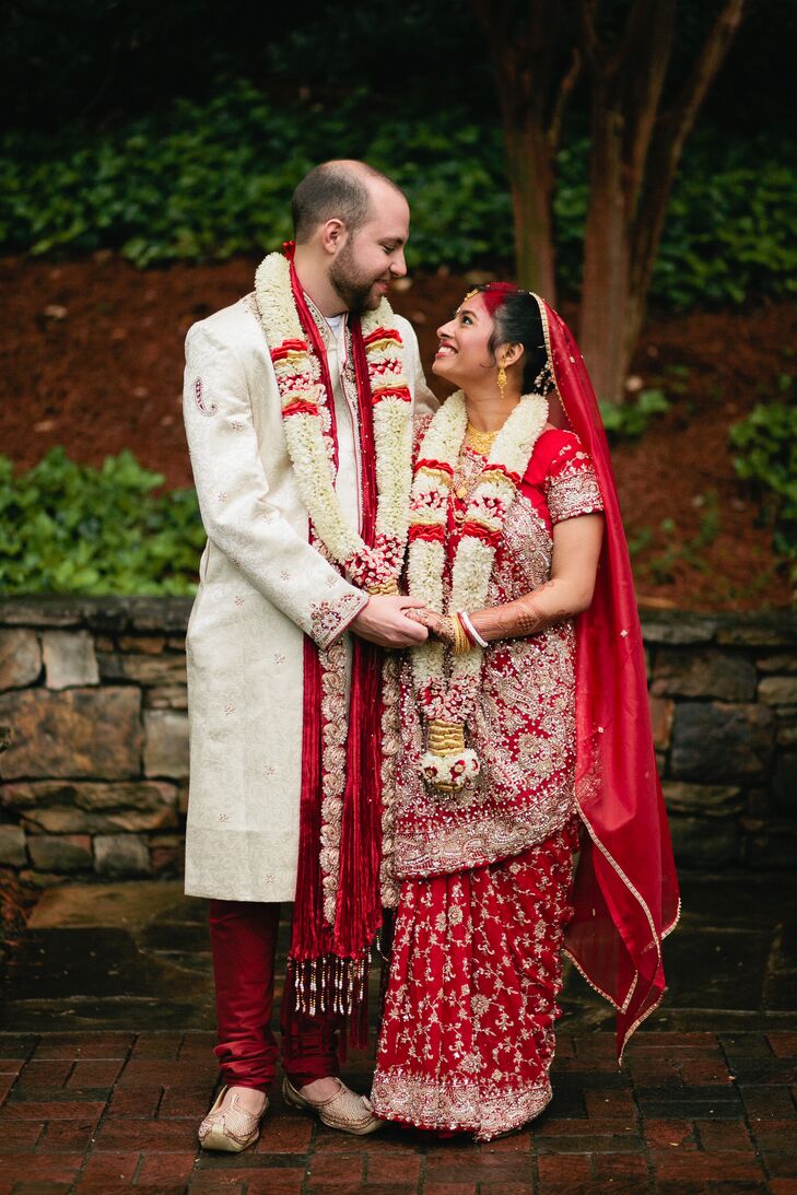 Bride And Groom In Red Traditional Indian Wedding Attire