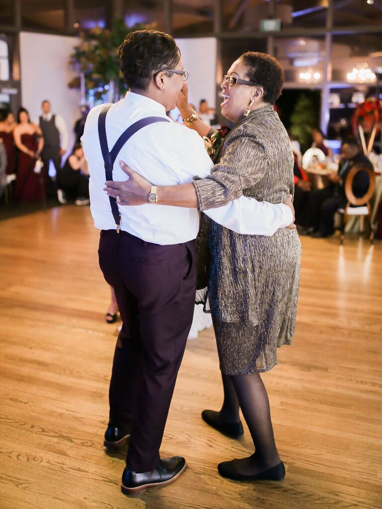Daughter and mother dancing on the dance floor together. 