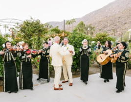 Grooms dancing while Mariachi band plays