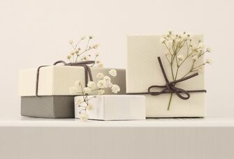 Lovely wrapped wedding presents with fresh florals