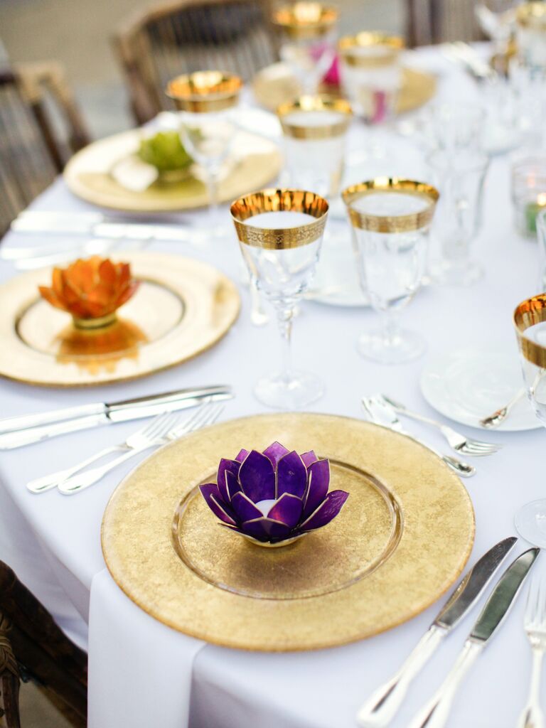 Lotus candle holders at the wedding reception dinner tables.
