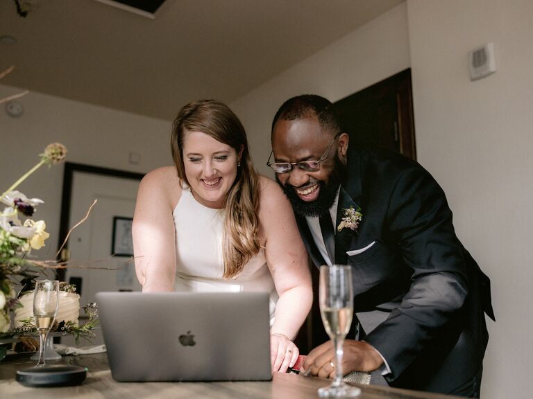 Bride and groom on laptop