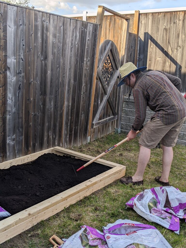 Aaron making his first garden bed in the backyard.