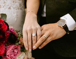 Bride and groom wearing wedding bands