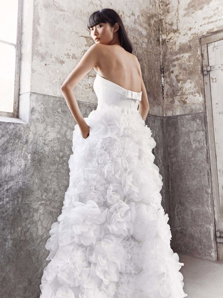 viktor and rolf white strapless wedding dress with ruffled ball gown skirt with allover tulle flowers pockets and back bow