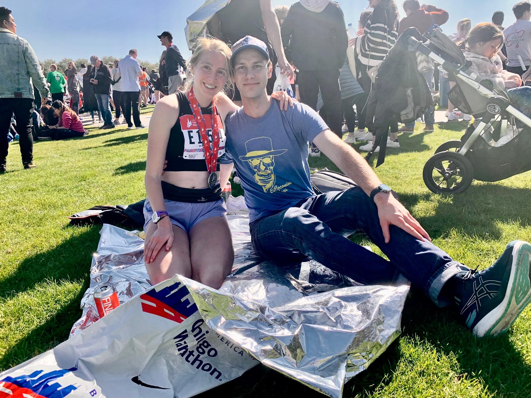 John cheers Nora on at the Chicago Marathon.