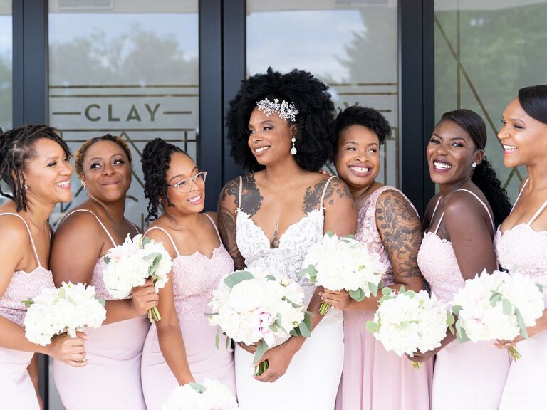 bride with bridesmaids smiling
