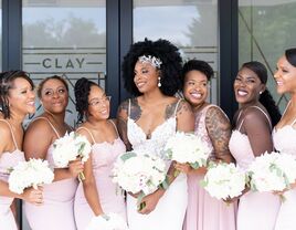 bride with bridesmaids smiling