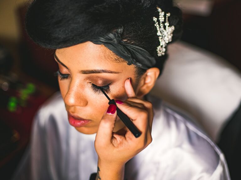 Bride getting her makeup done.