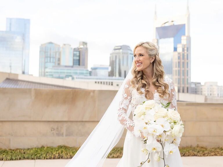 Beautiful bride with a city skyline in the backdrop