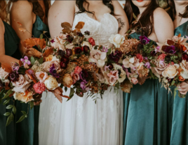 Bridal party holding Rustic Fall Jewel Tone Bouquets With Leaves, Roses and Viburnum