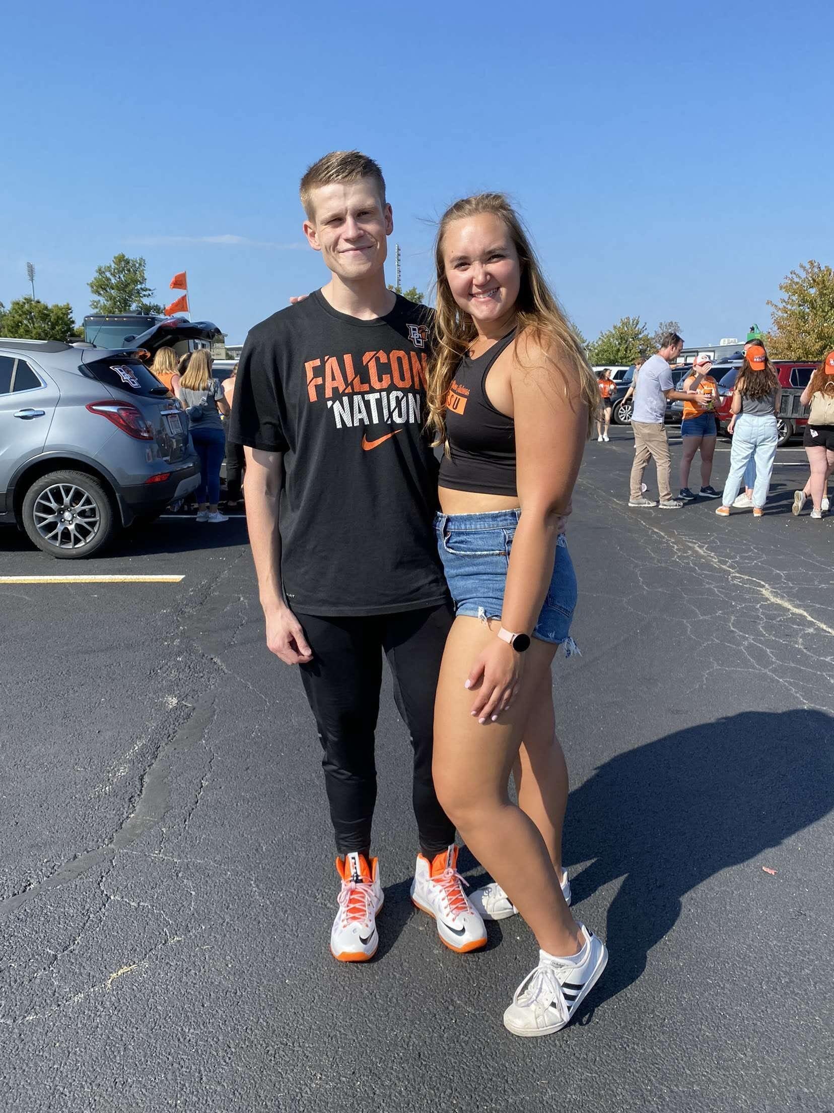 Kevin and Emily cheer on the BGSU football team
