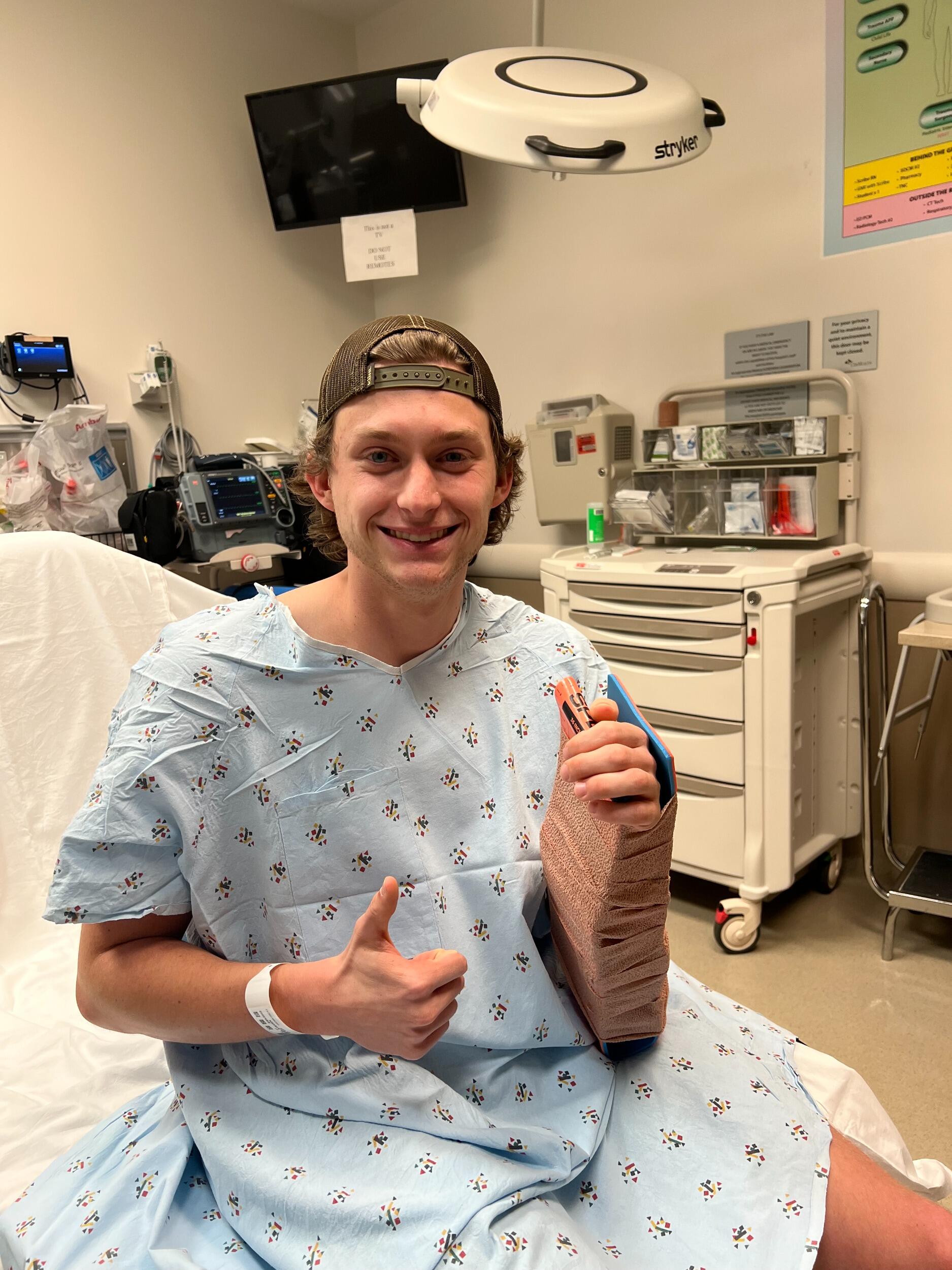 Matt broke his wrist playing flag football, but he kept his smile.