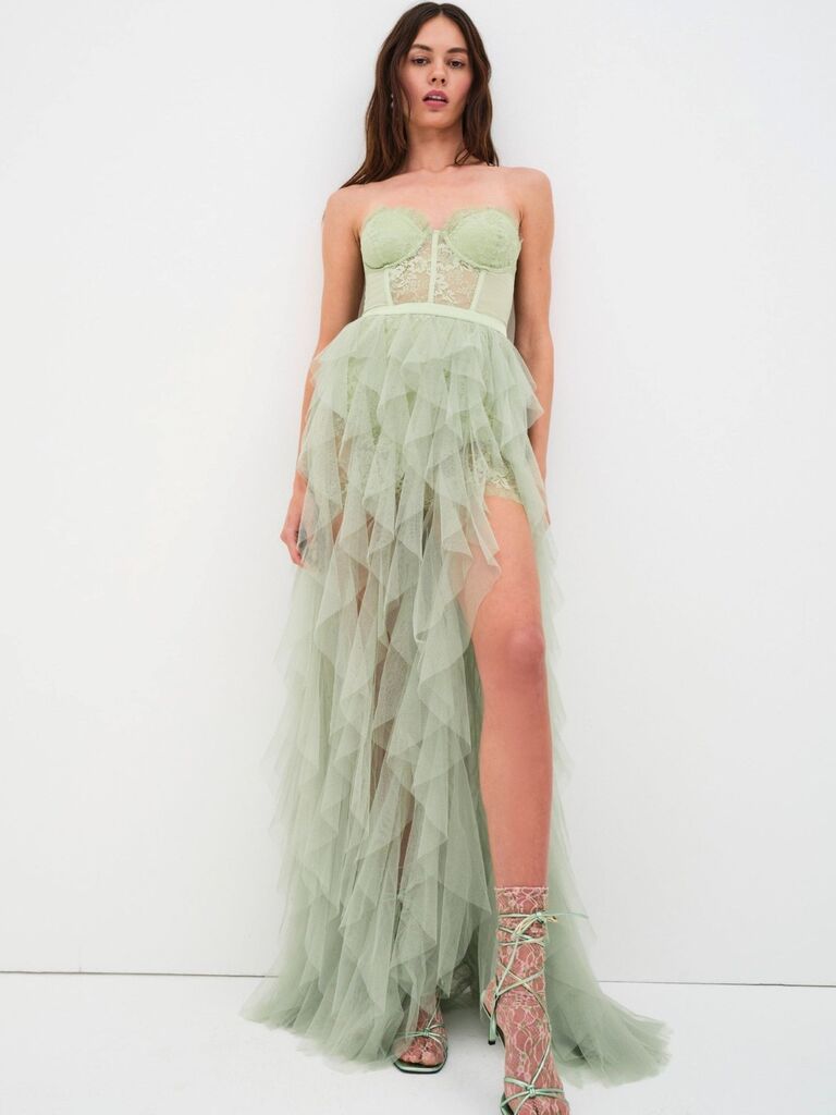 Sage green ruffled slit skirt corset bodice maxi dress on model