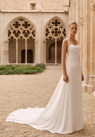 Straight silhouette wedding dress in textured satin with square neckline, straps, lace embellishment on the bodice. Includes train.