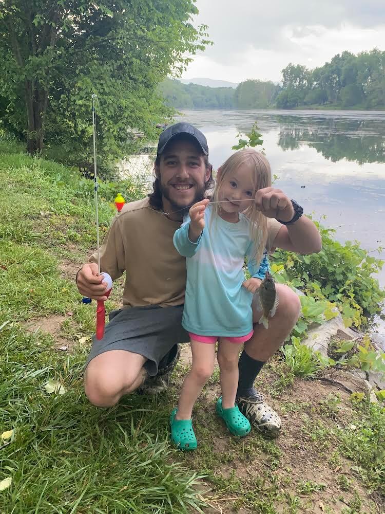 Daddy helps Eva catch her first fish in Shenandoah, VA!