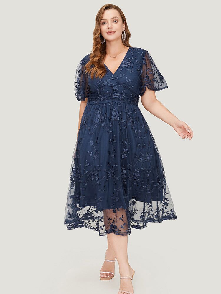 A mesh dark blue floral midi dress in plus-size from Bloomchic