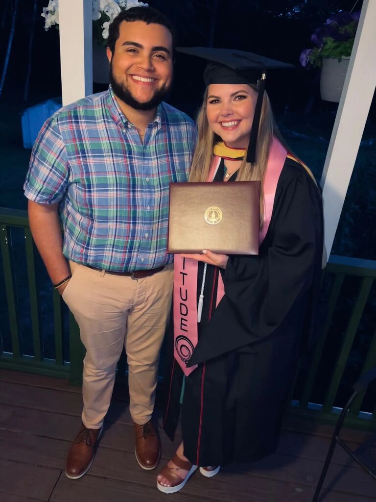 Alex completing her masters degree in Social Work.