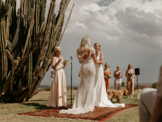 Same sex female couple at destination wedding ceremony