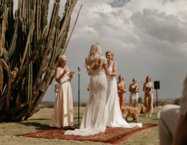 Same sex female couple at destination wedding ceremony