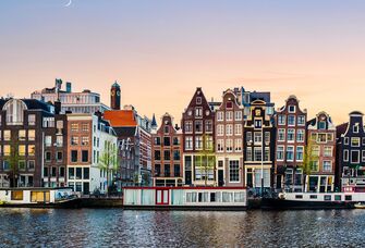 amsterdam with crescent moon hovering over city iconic landmarks