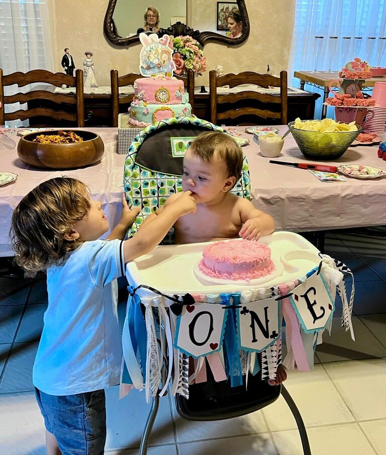 We celebrated our daughter's first birthday in Florida. The theme of the party was Scarlett in Wonderland, and she did look adorable in that blue dress.