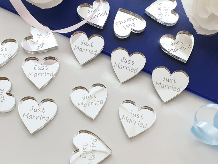 Acrylic white heart confetti with 'Just married' in simple type